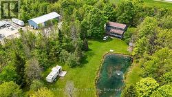 Wow! House with shop, ponds and over 8 acres! -