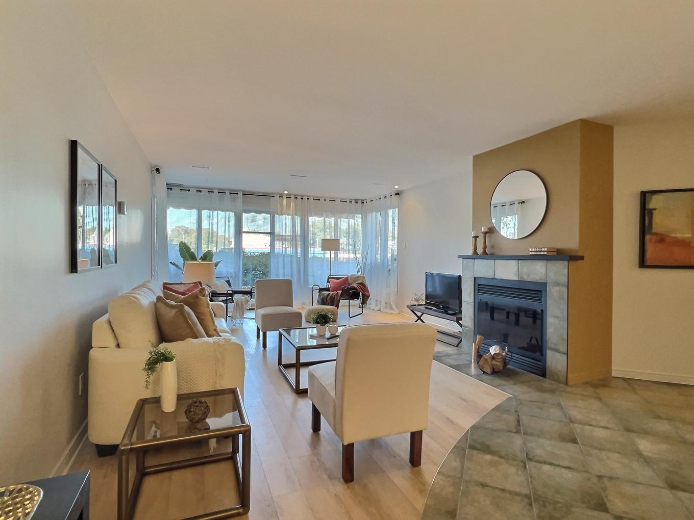 Salon - 109-100 Boul. J.-S.-Archambault, Terrebonne (Terrebonne), QC - Indoor Photo Showing Living Room With Fireplace