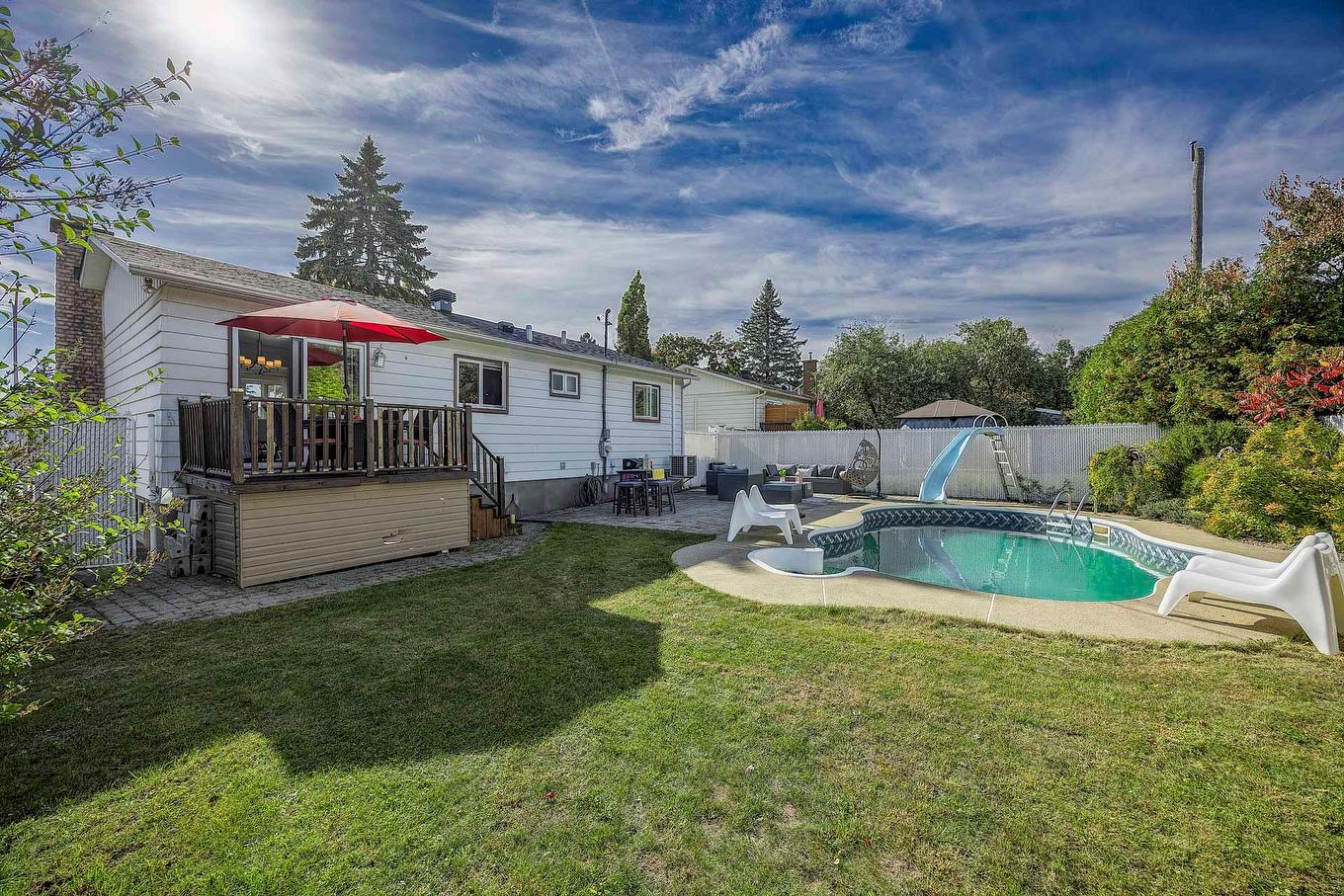 Pool - 447 Boul. Samson, Laval (Sainte-Dorothée), QC - Outdoor With In Ground Pool With Deck Patio Veranda