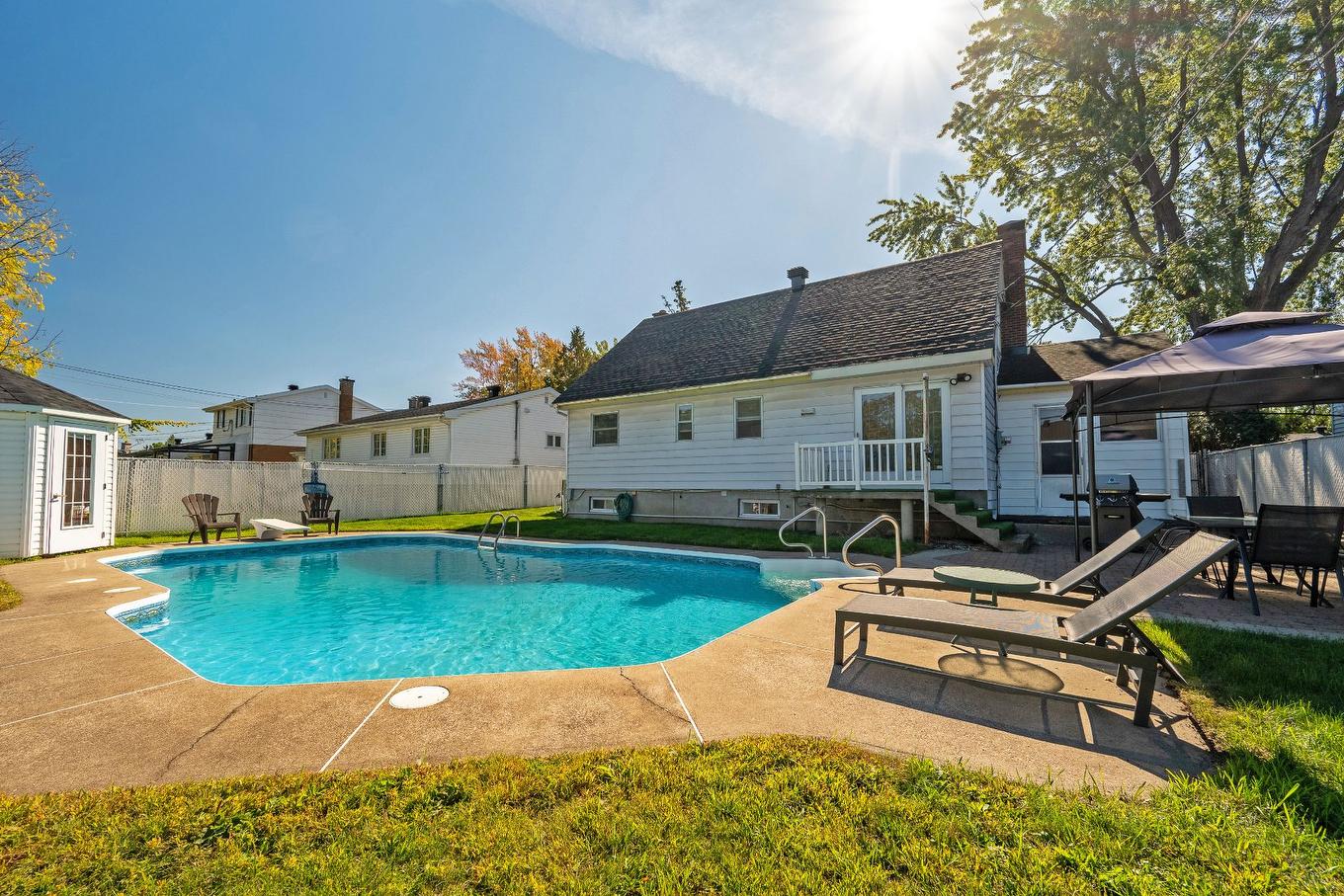 Backyard - 173 Rue Des Marguerites, Châteauguay, QC - Outdoor With In Ground Pool With Deck Patio Veranda With Backyard