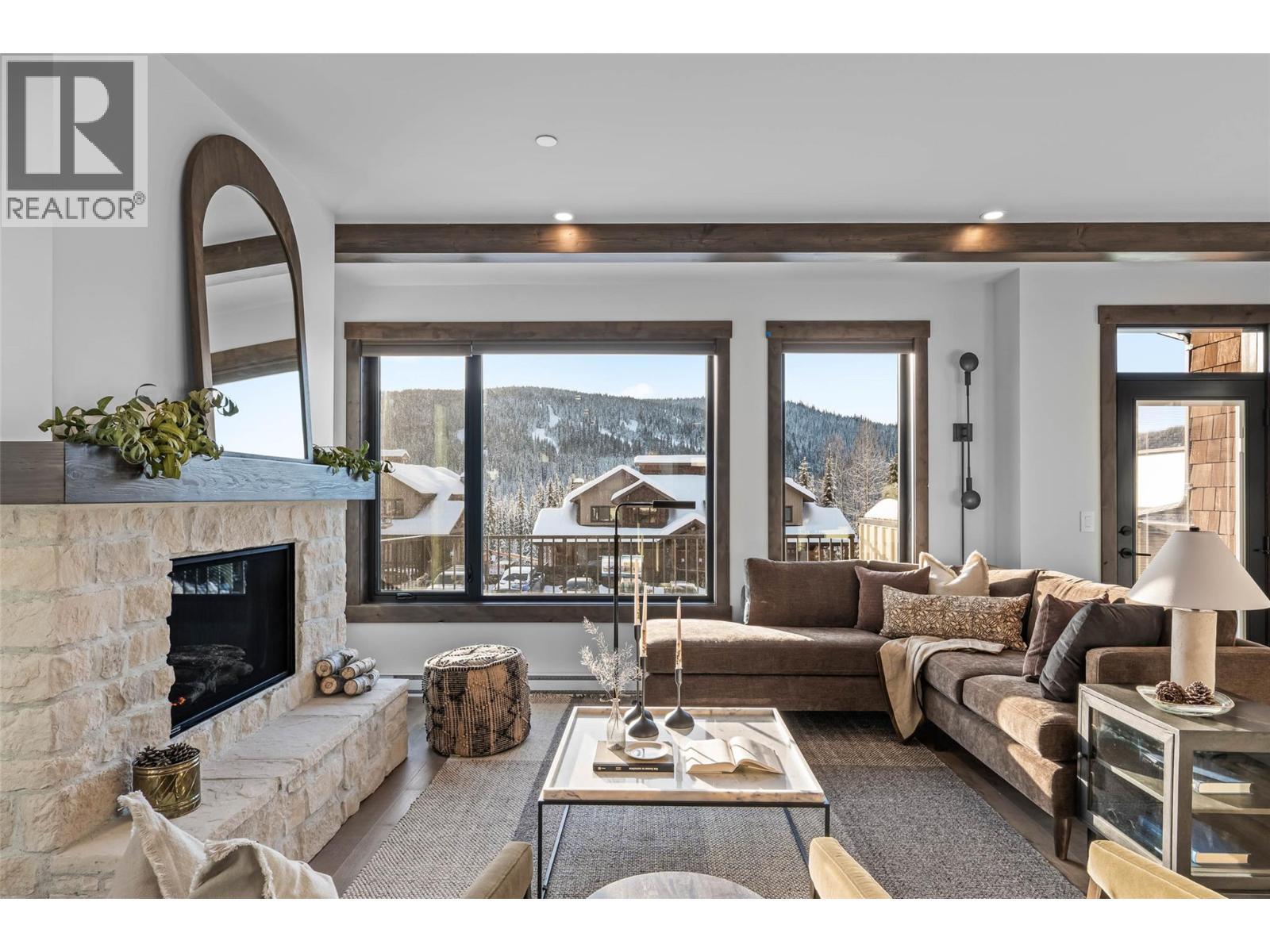 7000 Mcgillivray Lake Drive Unit# 16, Sun Peaks, BC - Indoor Photo Showing Living Room With Fireplace