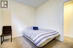 Bedroom featuring light carpet -