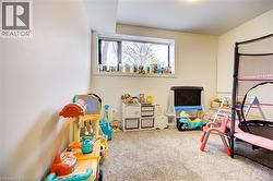 Rec room with light carpet -