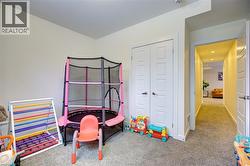 Rec room with carpet floors and baseboards -
