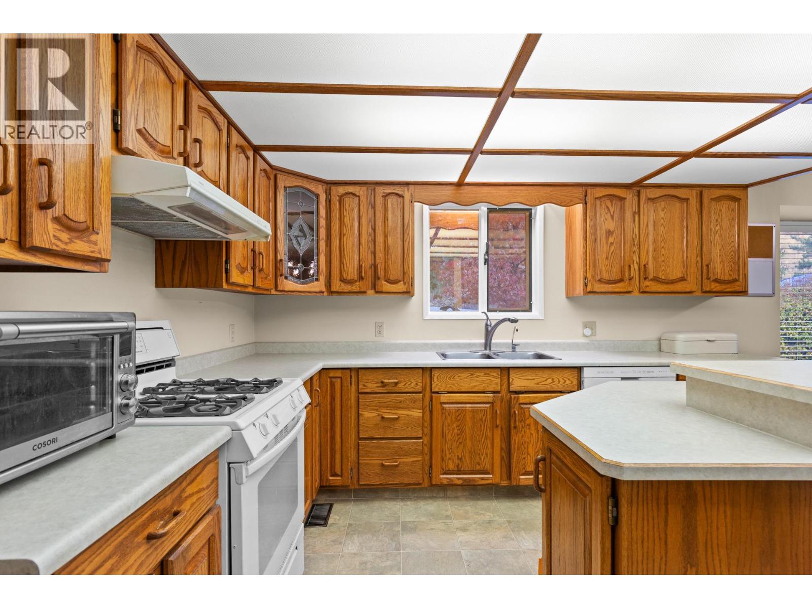 230 Cypress Drive, Coldstream, BC - Indoor Photo Showing Kitchen With Double Sink