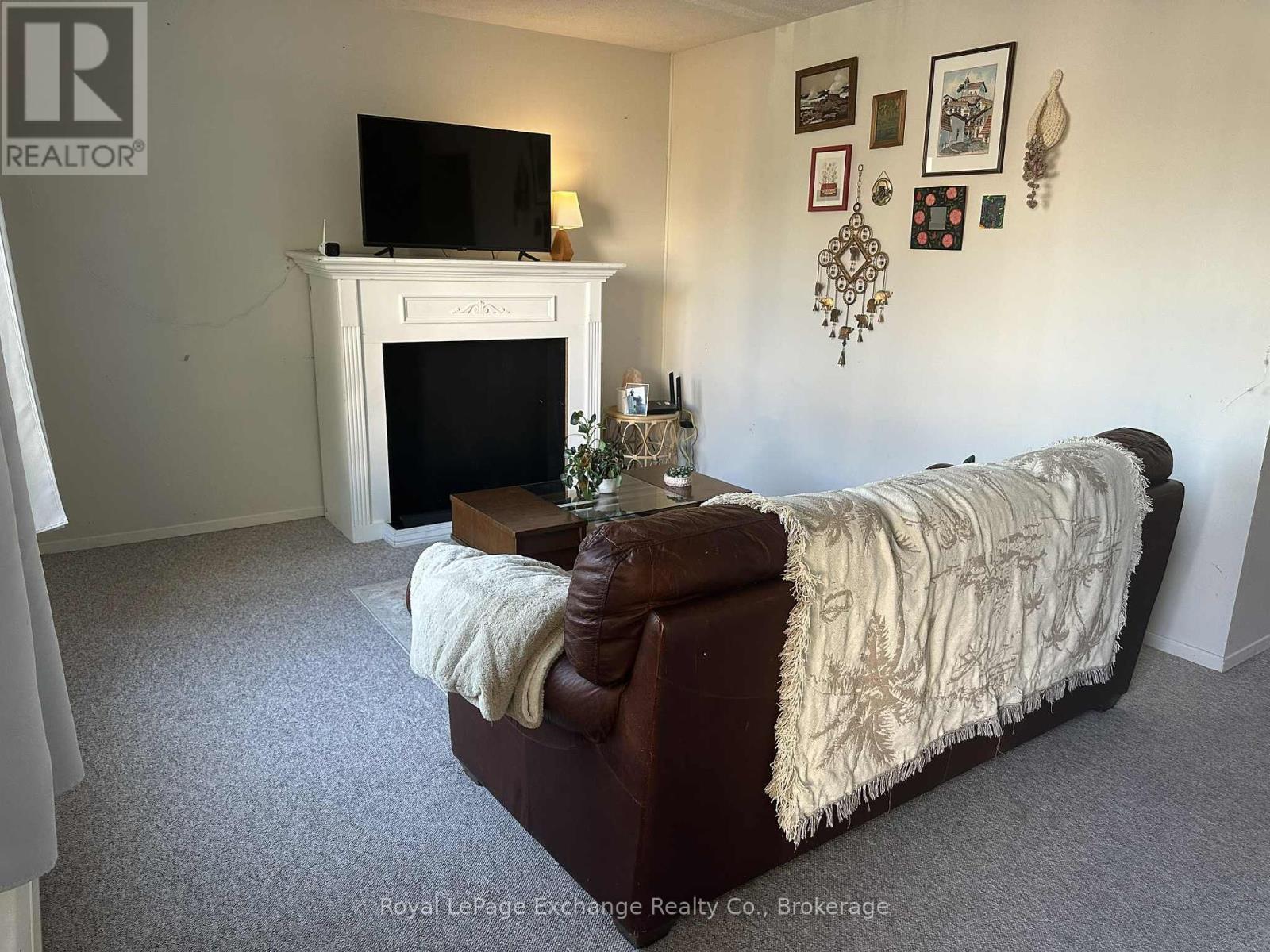Living room - 755 Walsh Street, Kincardine, ON - Indoor With Fireplace
