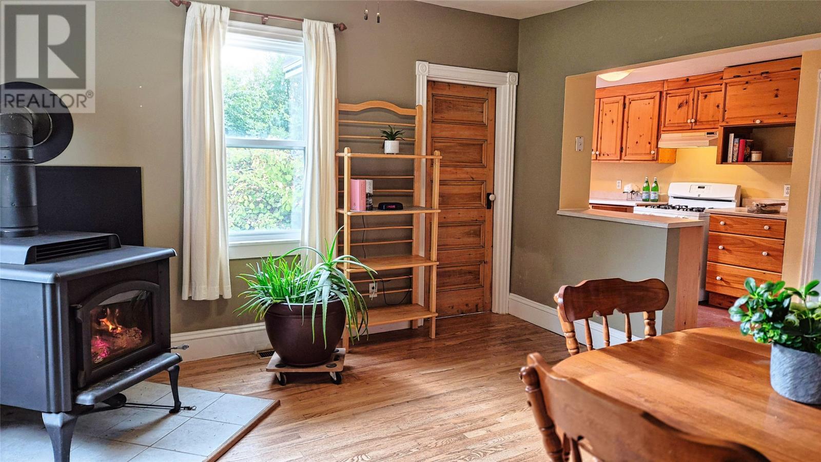 52-54 St Johns Road, Bay Bulls, NL - Indoor Photo Showing Other Room With Fireplace