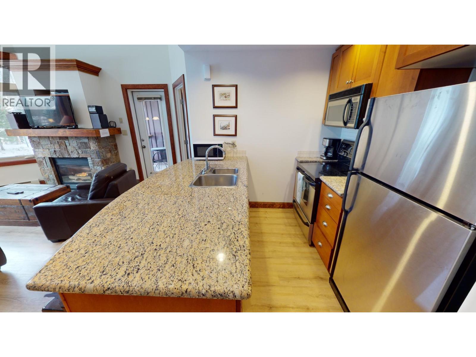 4559 Timberline Crescent Unit# 541, Fernie, BC - Indoor With Fireplace