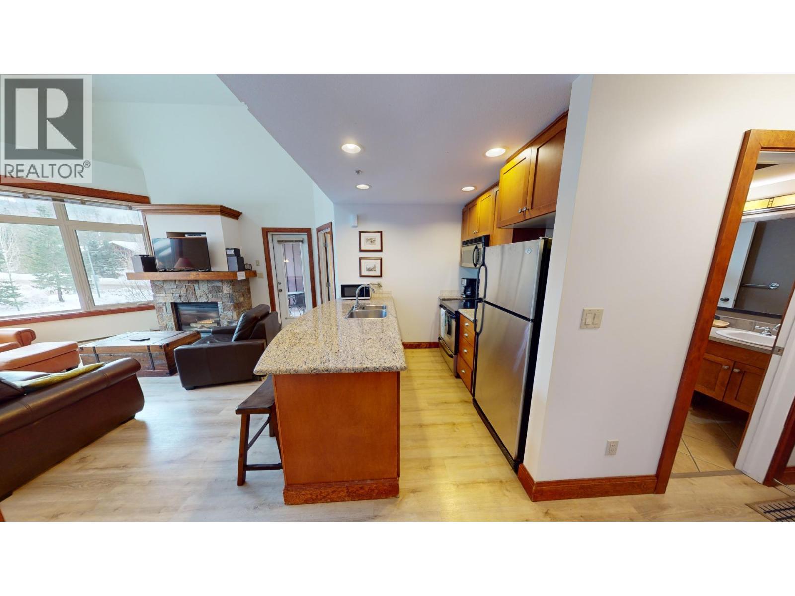 4559 Timberline Crescent Unit# 541, Fernie, BC - Indoor With Fireplace