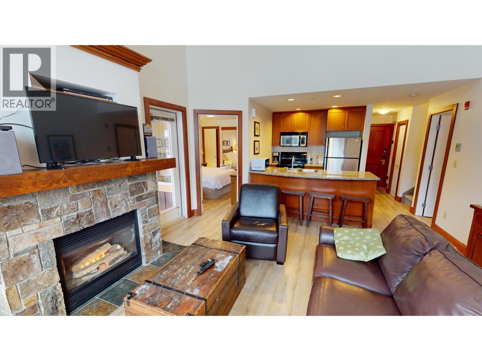 4559 Timberline Crescent Unit# 541, Fernie, BC - Indoor Photo Showing Living Room With Fireplace
