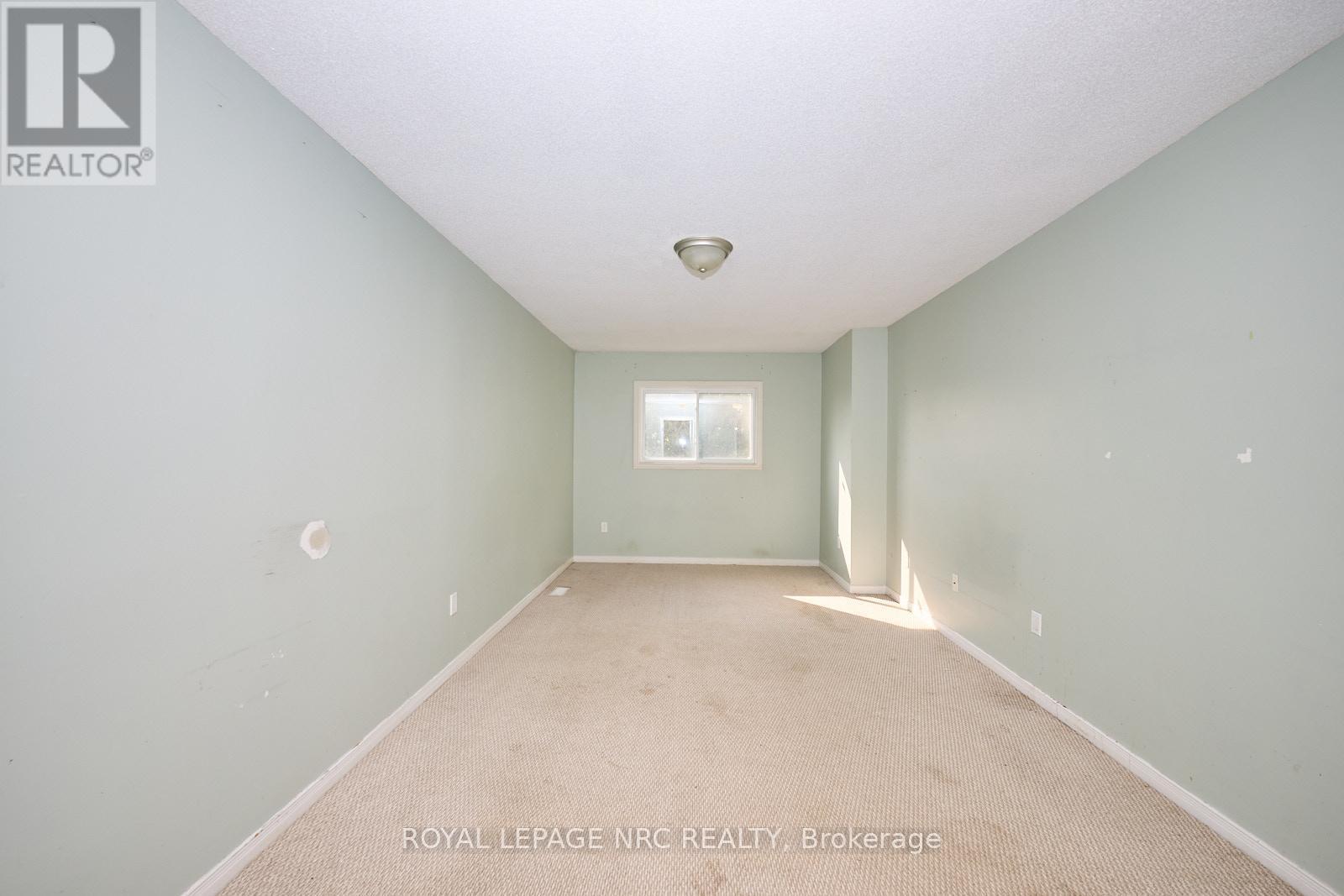 The primary bedroom upstairs - 14 Buss Court, Thorold (Confederation Heights), ON - Indoor Photo Showing Other Room