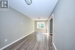 Living room with vinly flooring. -