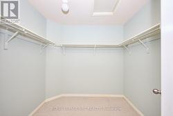 The primary bedroom offers a walk-in closet. -
