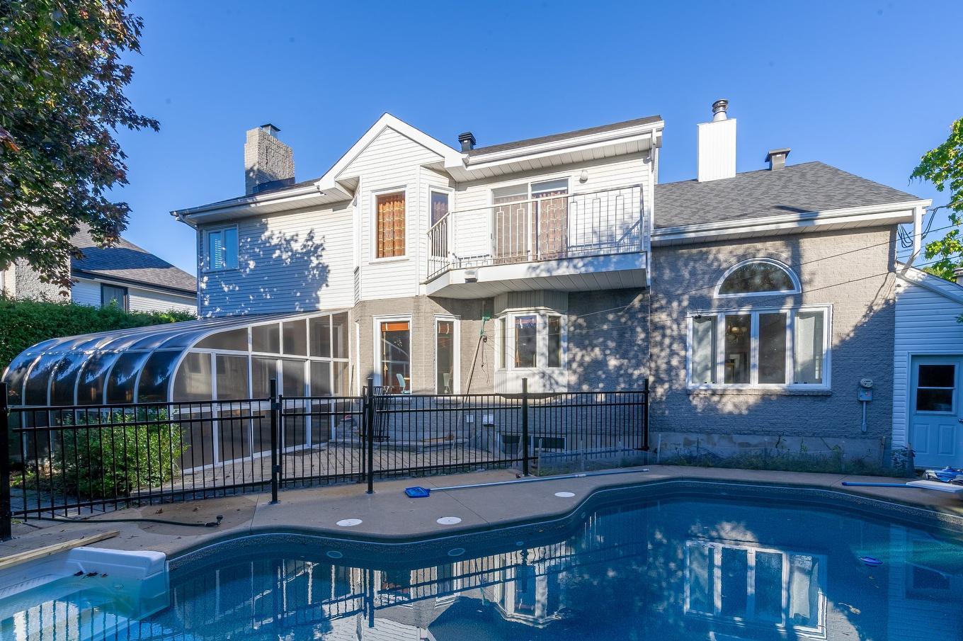 Back facade - 8890 Crois. Roussin, Brossard, QC - Outdoor With In Ground Pool