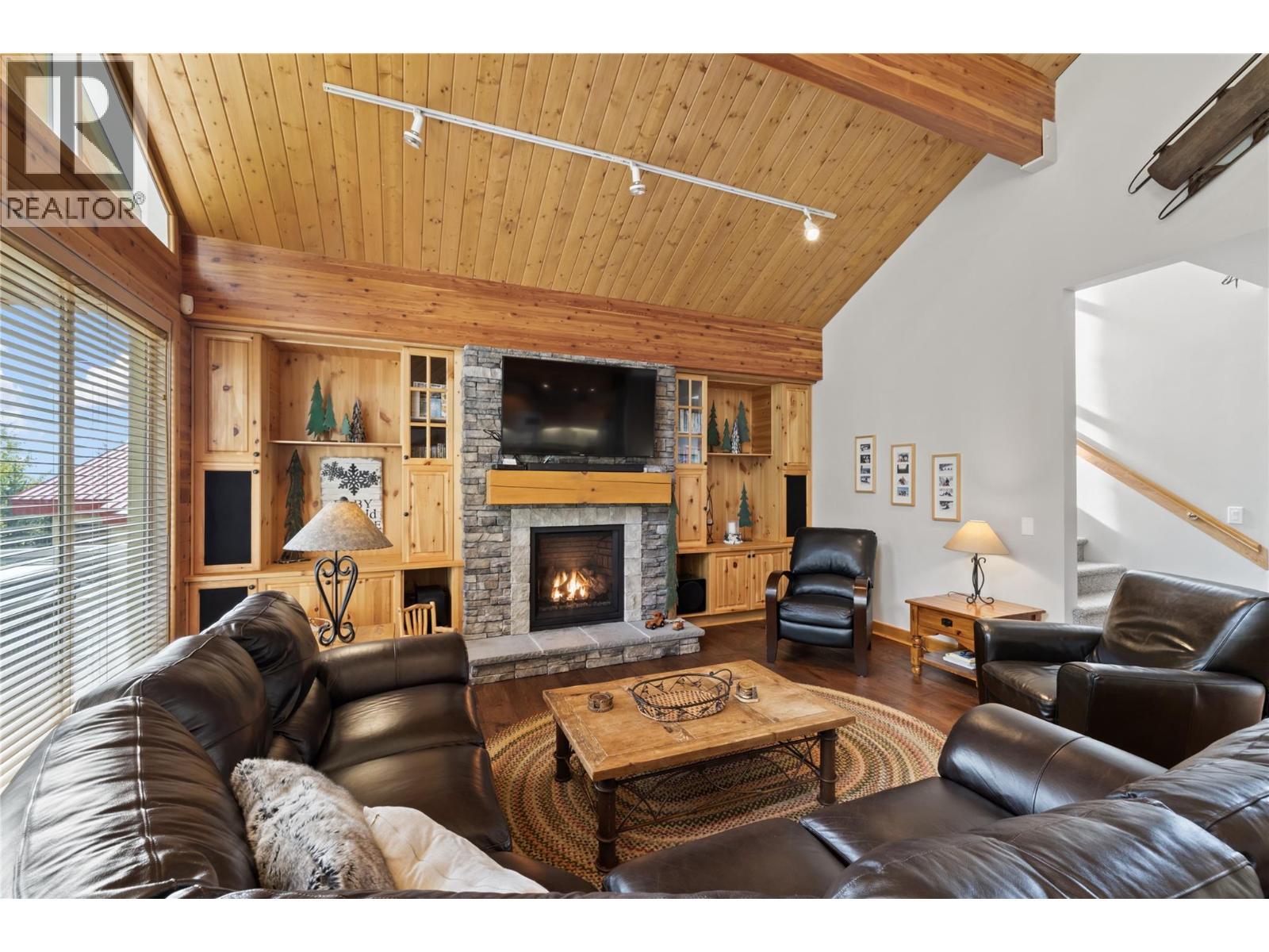 5946 Snow Pines Crescent Unit# A, Big White, BC - Indoor Photo Showing Living Room With Fireplace