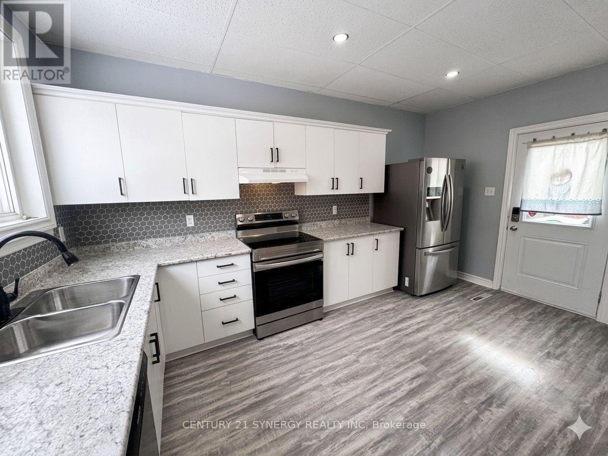 Colour enhanced - 25 Kensington Avenue, Smiths Falls, ON - Indoor Photo Showing Kitchen With Double Sink