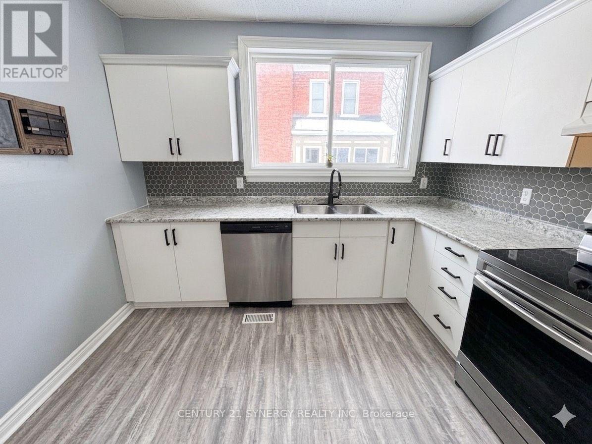 Colour enhanced - 25 Kensington Avenue, Smiths Falls, ON - Indoor Photo Showing Kitchen With Double Sink