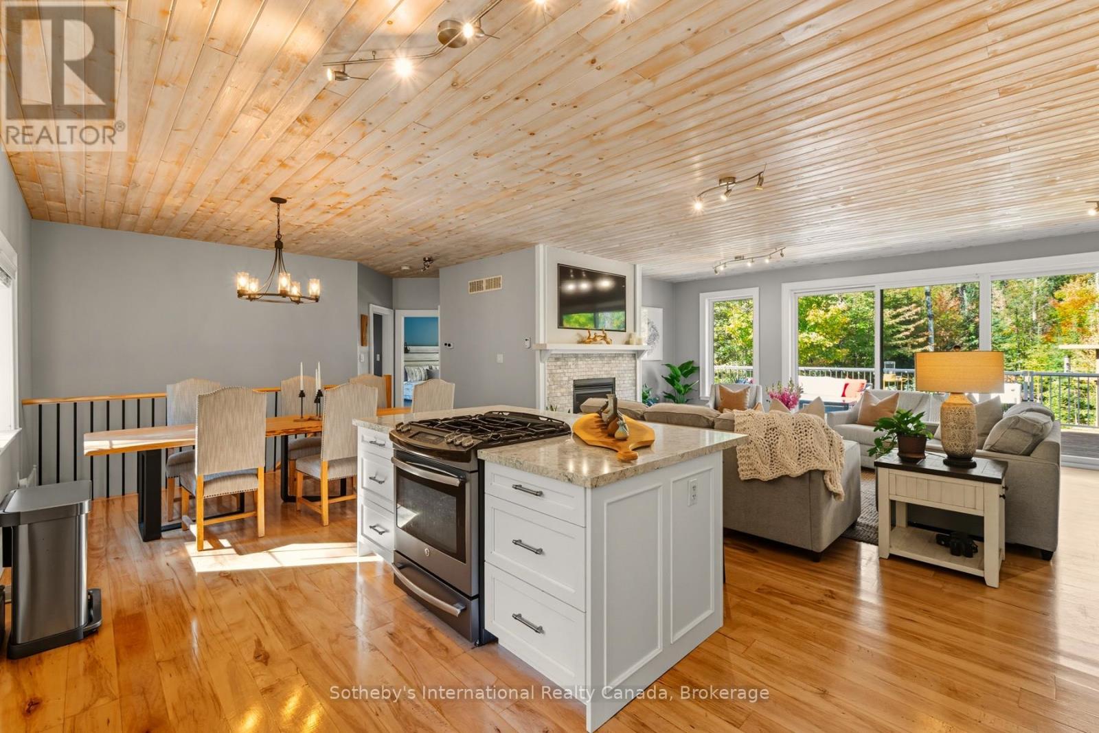 64 Bowyer Road, Huntsville (Chaffey), ON - Indoor Photo Showing Other Room With Fireplace
