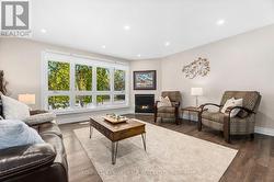 Living Room with large window and gas fireplace -