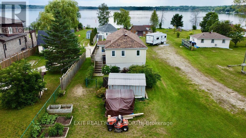Fully winterized home & cottage on Orr Lake - 5632 Penetanguishene Road, Springwater, ON - Outdoor With Body Of Water