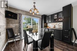 dining room with wetbar and access to backyard -