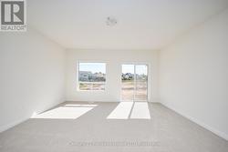 Living room with patio doors to backyard -