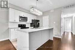 Bright kitchen with pantry and breakfast bar -