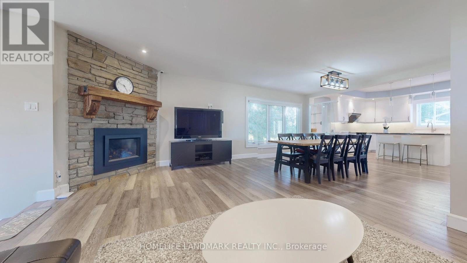208 Lakeshore Drive, Kawartha Lakes, ON - Indoor Photo Showing Living Room With Fireplace