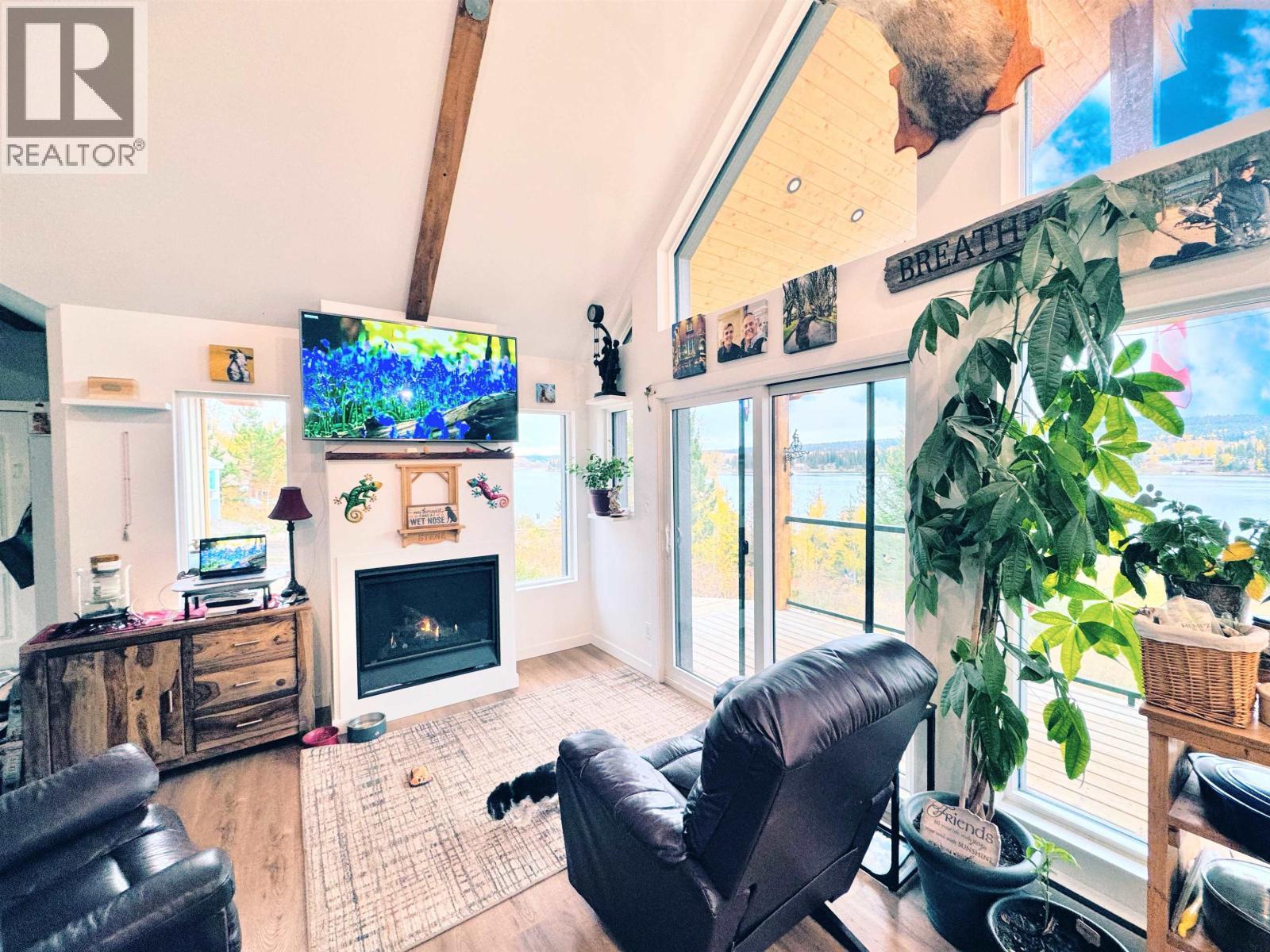 6656 North Shore Horse Lake Road, Horse Lake, BC - Indoor With Fireplace