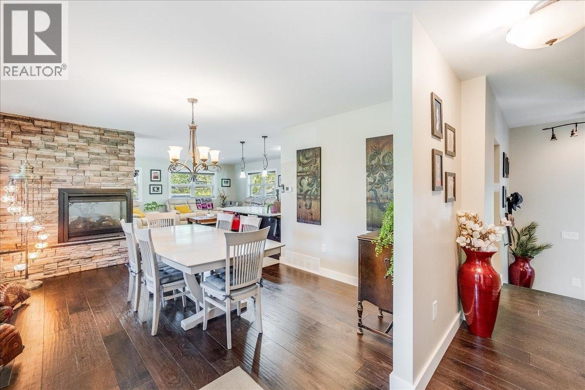 6010 Harrop-Procter Road, Nelson, BC - Indoor Photo Showing Dining Room With Fireplace