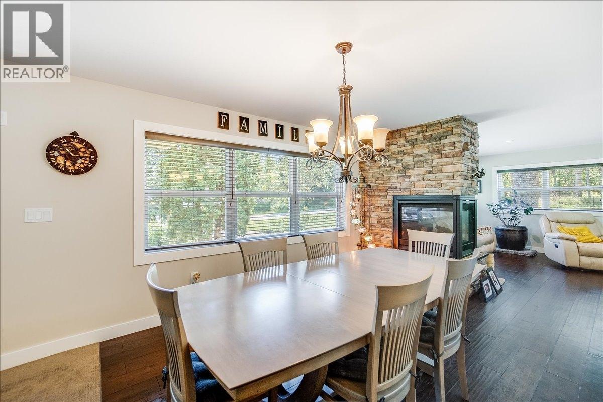 6010 Harrop-Procter Road, Nelson, BC - Indoor Photo Showing Dining Room With Fireplace