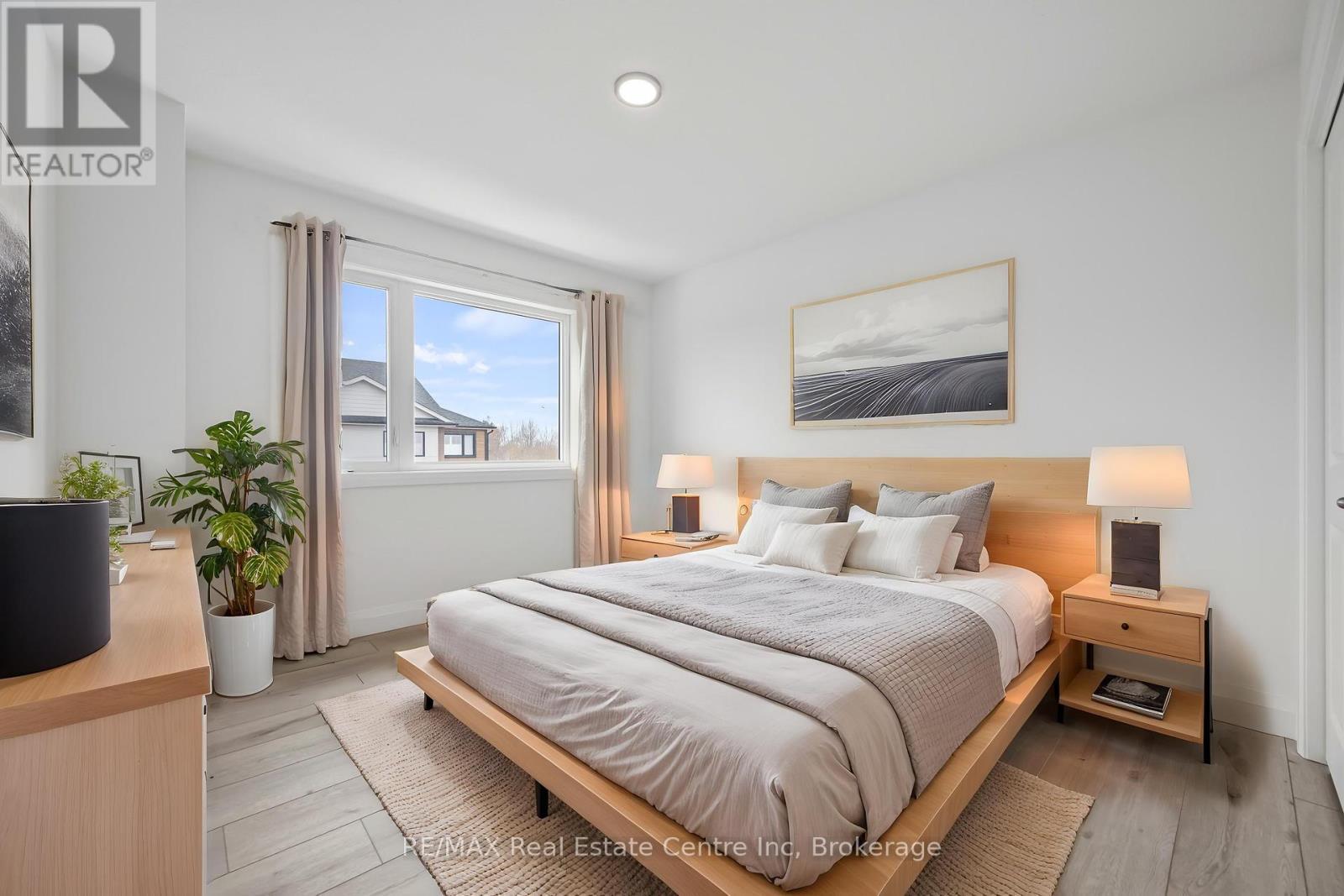 Photo has been virtually staged - 8 - 182 Bridge Crescent, Minto, ON - Indoor Photo Showing Bedroom