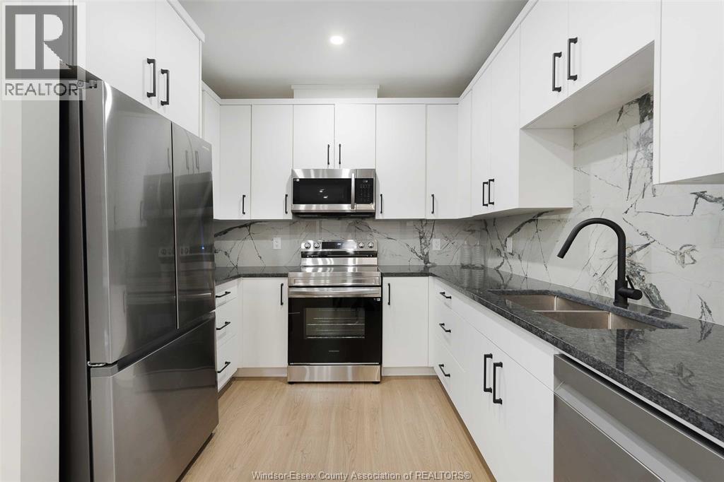 755 Grand Marais Unit# 102, Windsor, ON - Indoor Photo Showing Kitchen With Double Sink