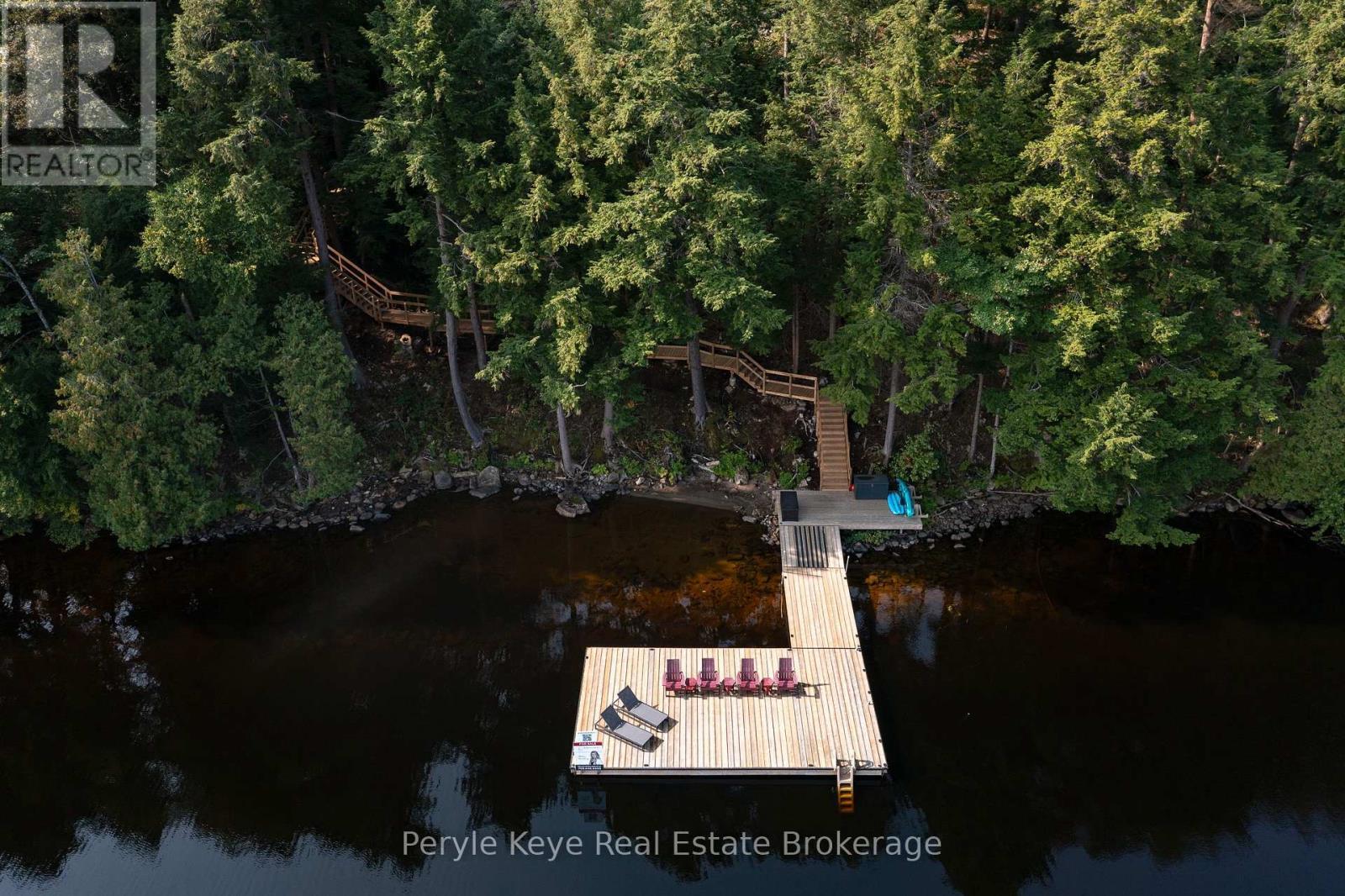 Expansive Dock & Uncrowded Shoreline - 86 Claren Crescent, Huntsville (Stisted), ON - Outdoor With Body Of Water