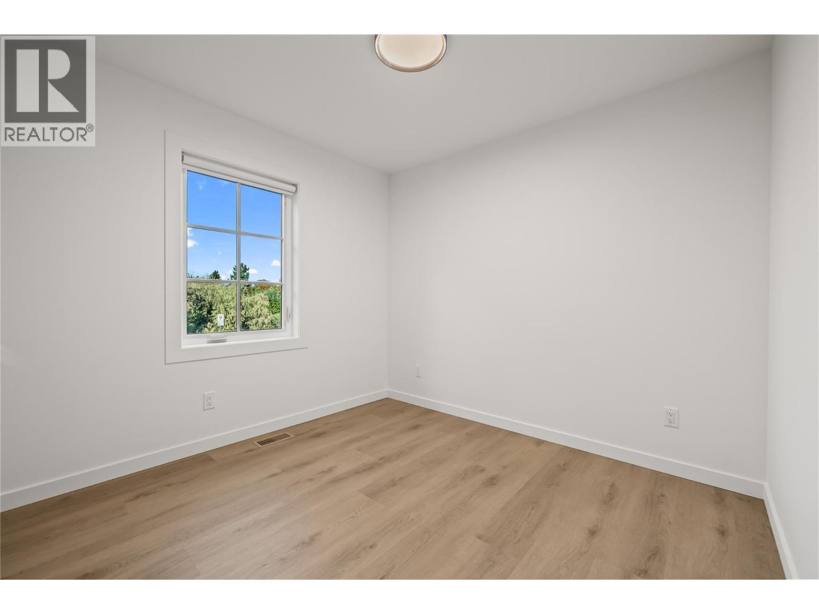 First Bedroom - 2957 Conlin Court Unit# 1, Kelowna, BC - Indoor Photo Showing Other Room