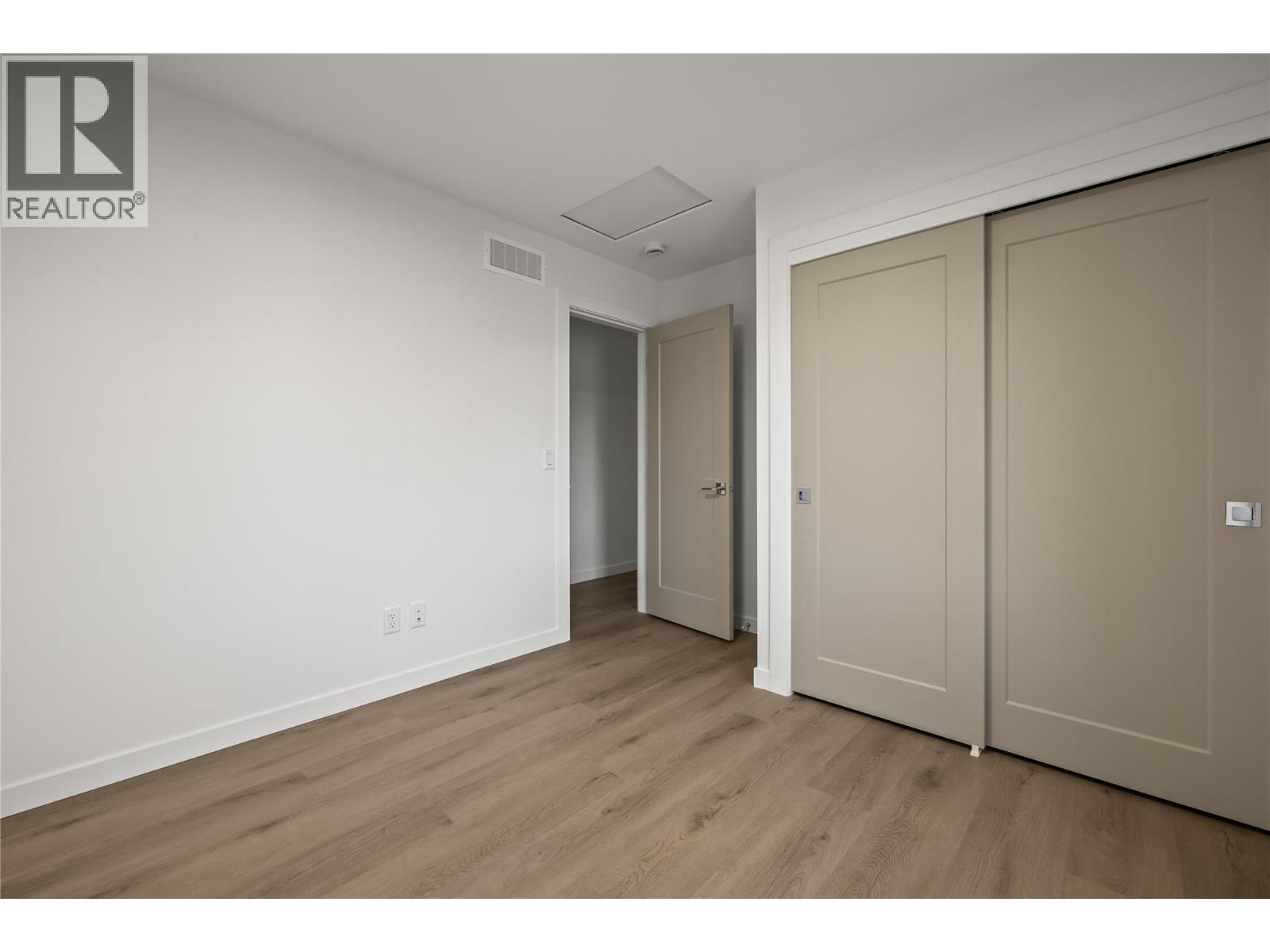 First Bedroom - 2957 Conlin Court Unit# 1, Kelowna, BC - Indoor Photo Showing Other Room