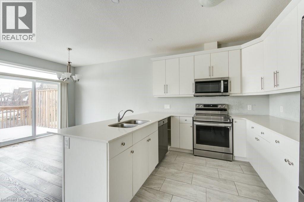 745 Chelton Road Unit# 62, London, ON - Indoor Photo Showing Kitchen With Double Sink