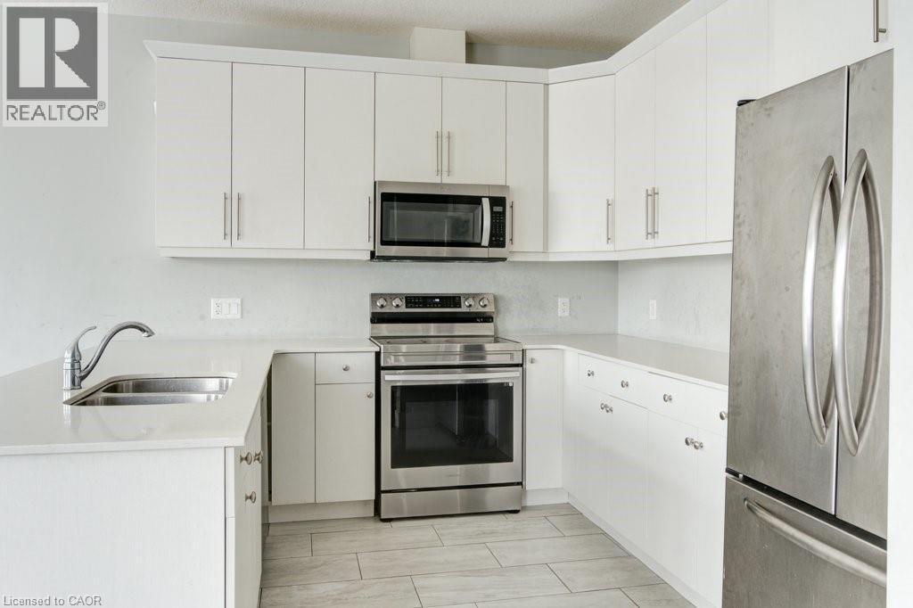 745 Chelton Road Unit# 62, London, ON - Indoor Photo Showing Kitchen With Double Sink