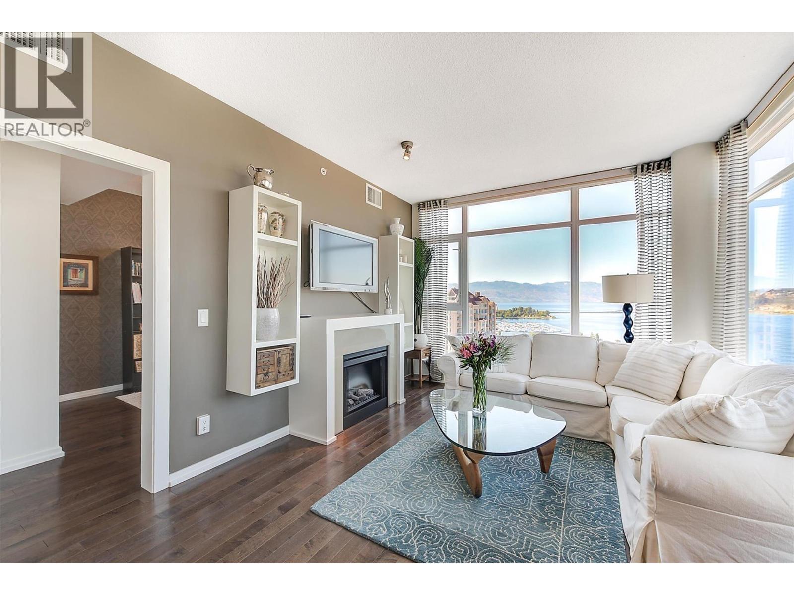 1075 Sunset Drive Unit# 2408, Kelowna, BC - Indoor Photo Showing Living Room With Fireplace