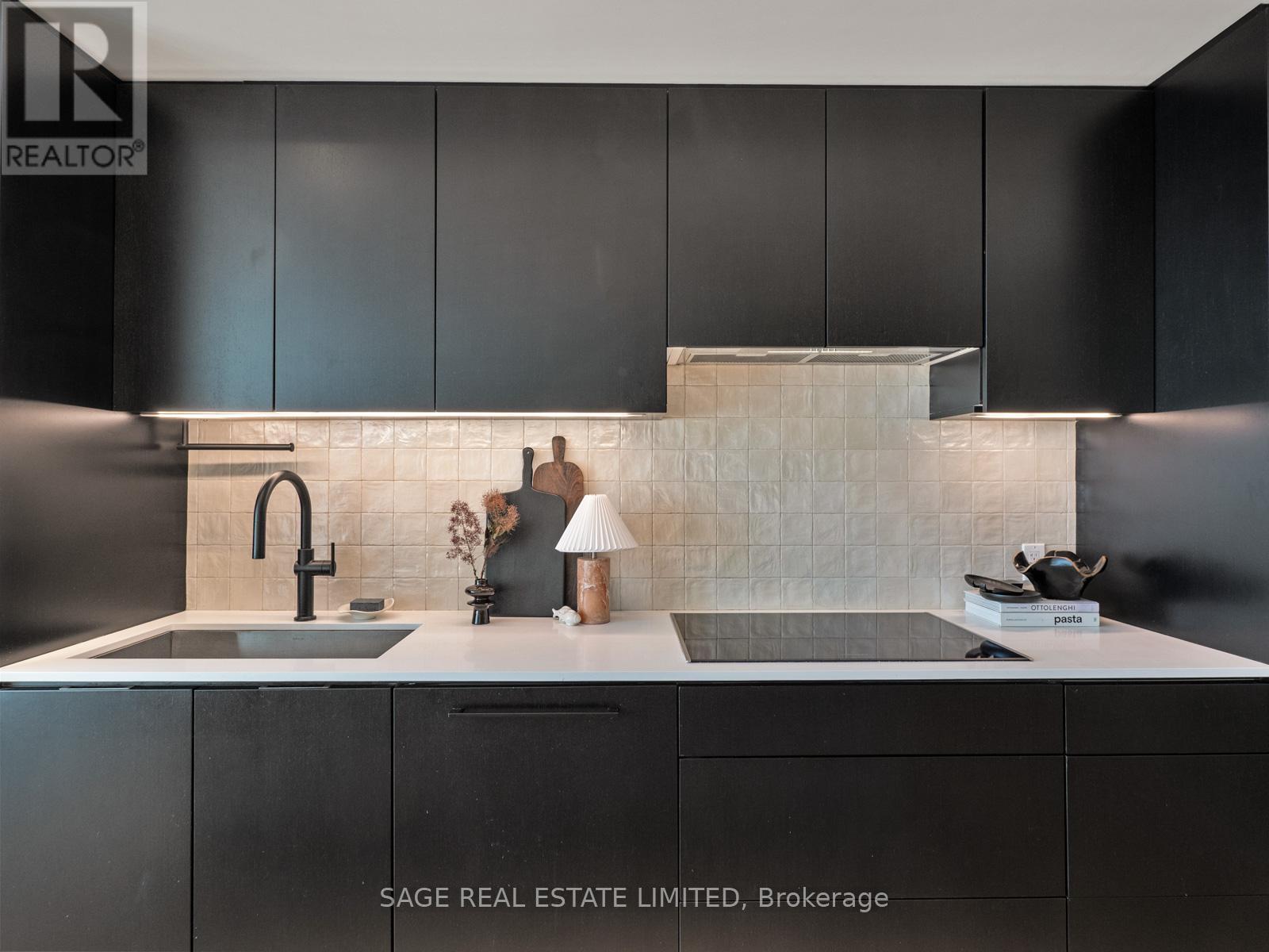 Custom designed black kitchen - Ph 621 - 899 College Street W, Toronto, ON - Indoor Photo Showing Kitchen