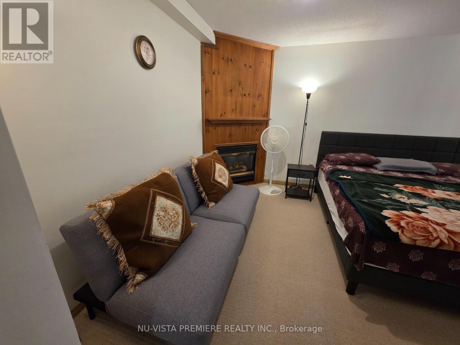 B1 - 650 Cheapside Street, London East (East C), ON - Indoor Photo Showing Bedroom With Fireplace