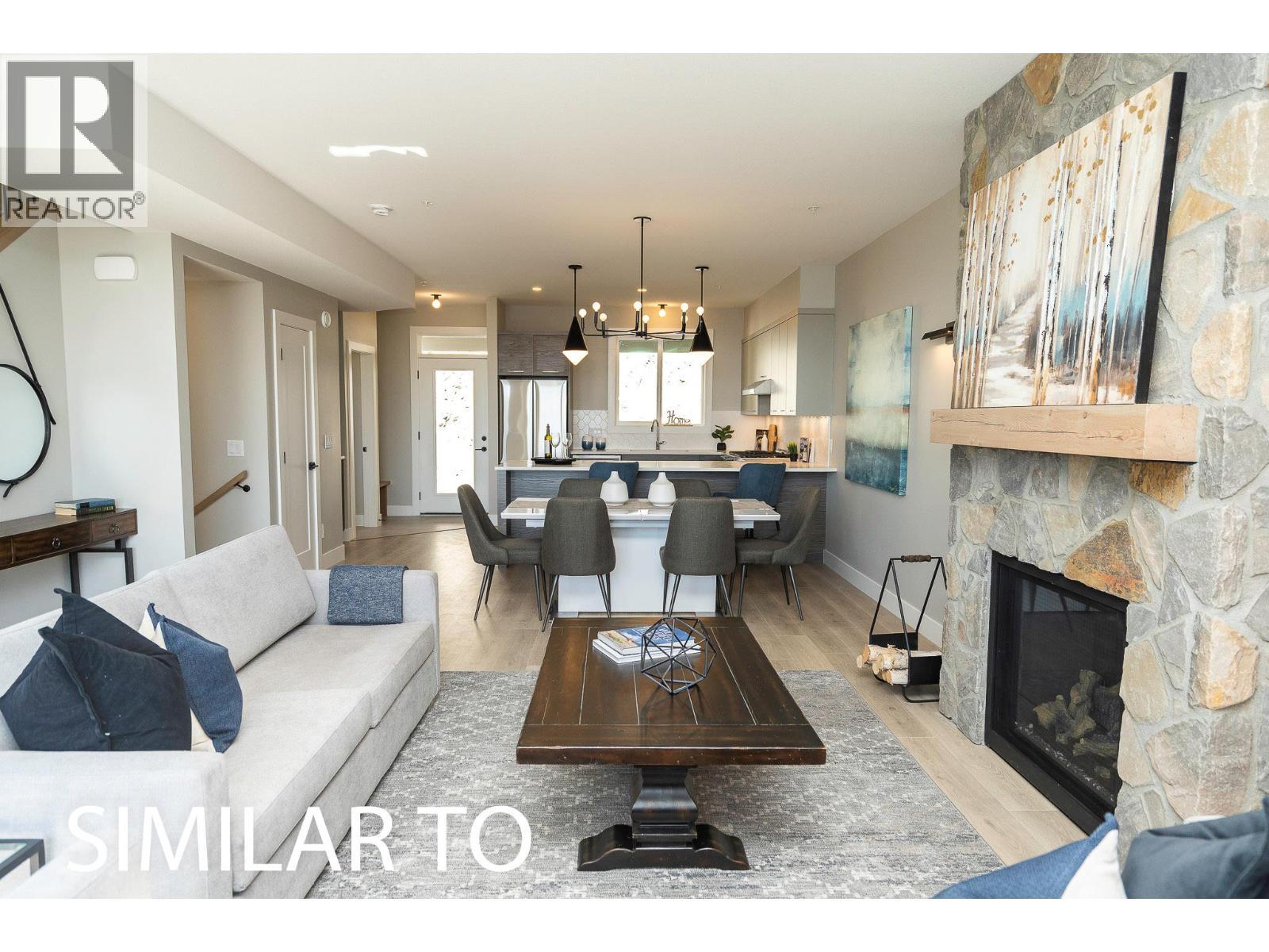 280B Grizzly Ridge Trail, Big White, BC - Indoor Photo Showing Living Room With Fireplace
