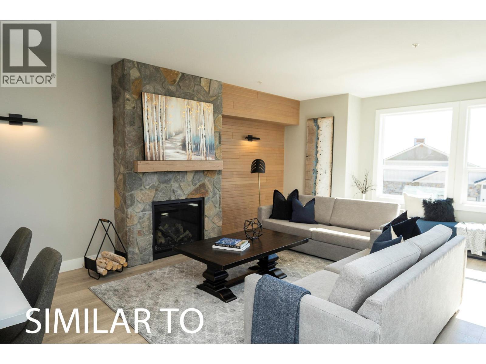 280B Grizzly Ridge Trail, Big White, BC - Indoor Photo Showing Living Room With Fireplace
