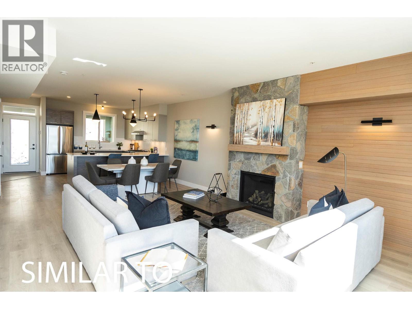 280B Grizzly Ridge Trail, Big White, BC - Indoor Photo Showing Living Room With Fireplace