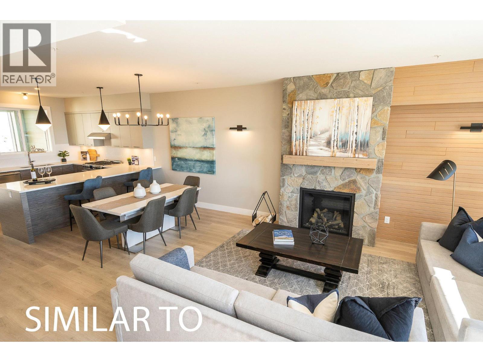 280B Grizzly Ridge Trail, Big White, BC - Indoor Photo Showing Living Room With Fireplace