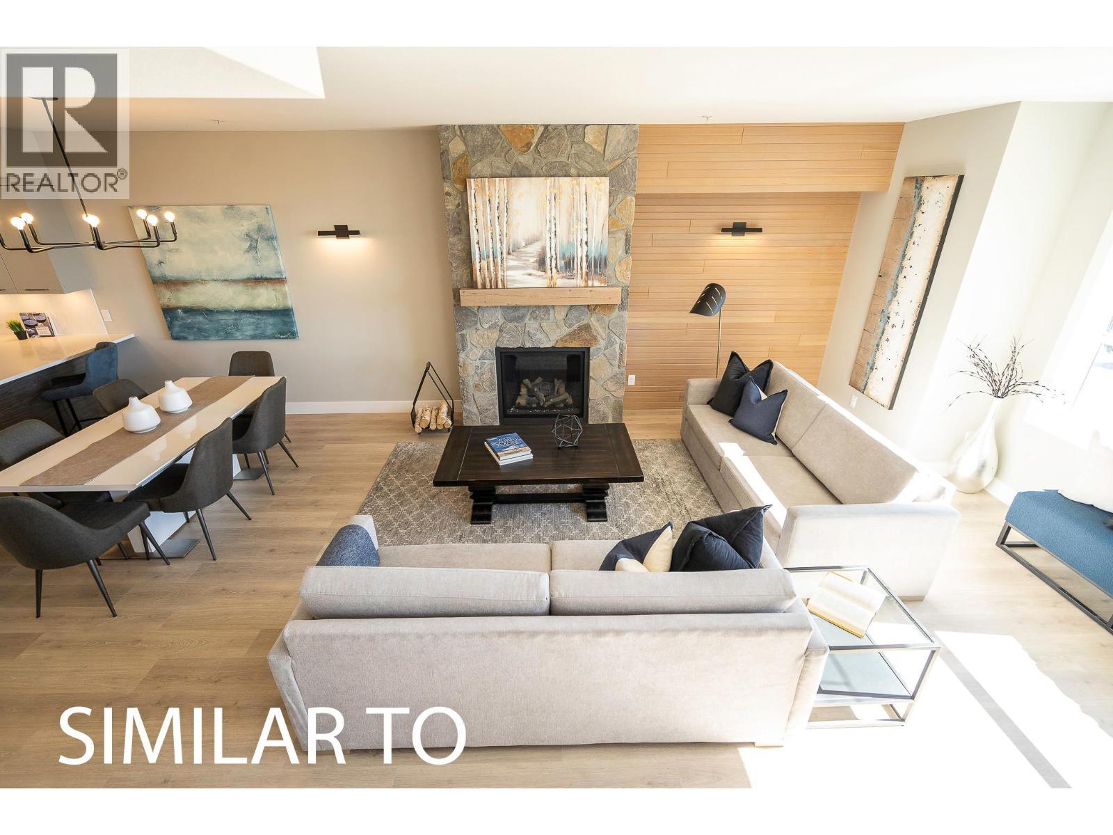 280B Grizzly Ridge Trail, Big White, BC - Indoor Photo Showing Living Room With Fireplace