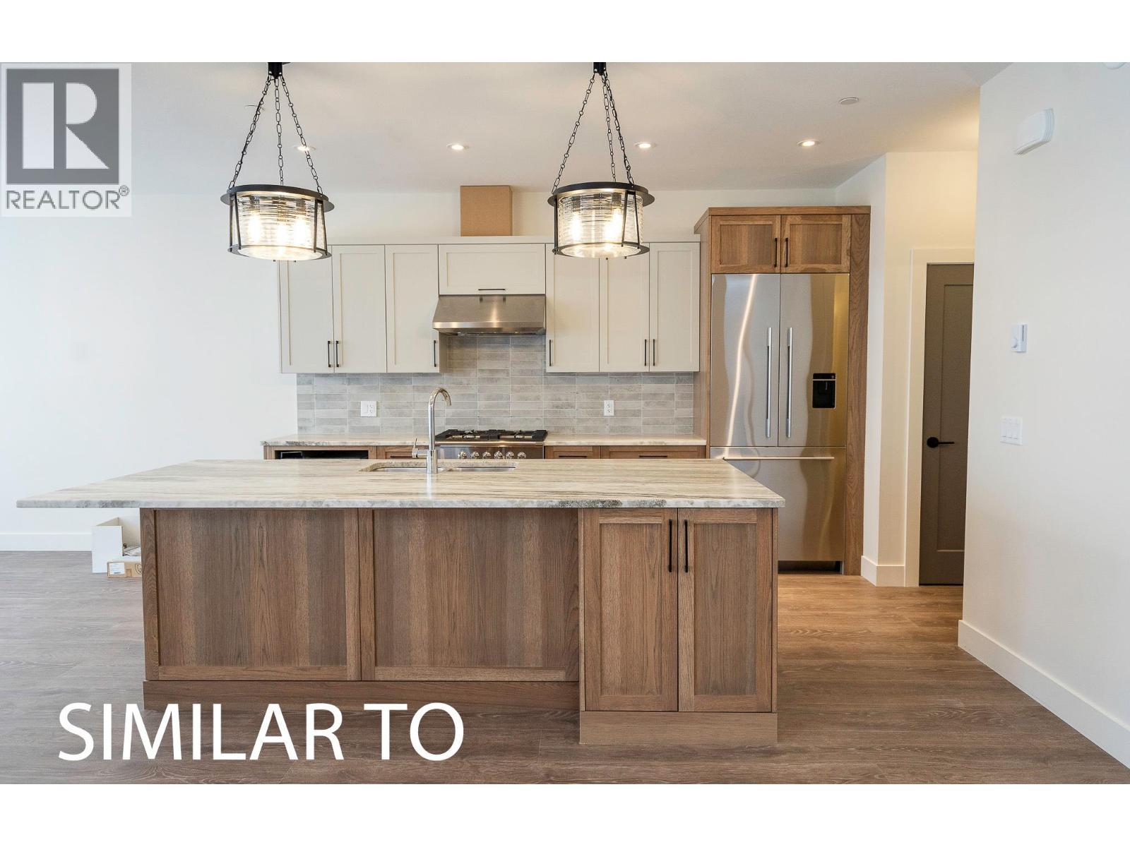 215B Grizzly Ridge Trail, Big White, BC - Indoor Photo Showing Kitchen With Upgraded Kitchen