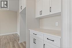 Detailed view of wood finished floors and baseboards -