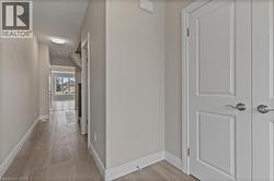 Hallway with baseboards -