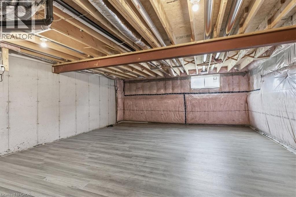 Basement featuring wood finished floors - 256 Keeso Lane, Listowel, ON - Indoor Photo Showing Basement
